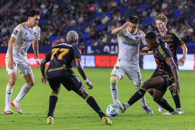 October 11, 2025, Los Angeles, California, USA: Gabriel Pec 11 of the LA Galaxy tries to get past FC Dallas defenders during their regular season MLS, Fussball Herren, USA match on Saturday October 11, 2025 at Dignity Health Sports Park Stadium in Carson, California. LA Galaxy defeats FC Dallas, 2-1. JAVIER ROJAS PI Los Angeles USA - ZUMAp124 20251011_zaa_p124_132 Copyright: xJavierxRojasx