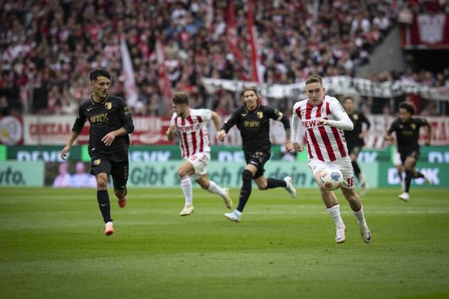 KOELN, GERMANY - OCTOBER 18: Isak Johannesson (1. FC Koeln, 18), Dimitris Giannoulis (FC Augsburg, 13) competing during the Bundesliga match between 1. FC Koeln vs. FC Augsburg at the Rheinenergie-Stadion on matchday 7 of the 1. Bundesliga on October 18, 2025 in Koeln, Germany. DFL REGULATIONS PROHIBIT ANY USE OF PHOTOGRAPHS AS IMAGE SEQUENCES AND OR QUASI-VIDEO. Nordrhein-Westfalen Germany Copyright: xBEAUTIFULxSPORTS AxelxKohringx