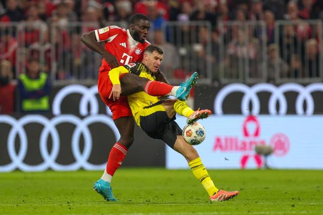 in duel, action, with Dayot Upamecano 2 FC Bayern Muenchen , Pascal Gross 13 Borussia Dortmund , FC Bayern Muenchen vs Borussia Dortmund, Football, 1 Bundesliga, 7 Matchday, 18 10 2025 DFB regulations prohibit any use of photographs as image sequences and or quasi video Muenchen Bayern Germany Copyright: xkolbert-press ChristianxKolbertx