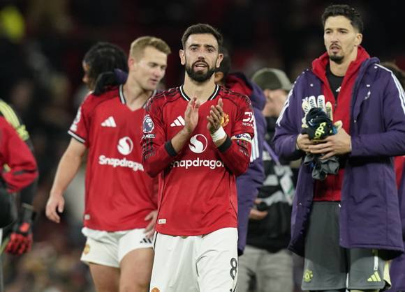 Manchester, England, 25th October 2025. Bruno Fernandes of Manchester United, ManU applauds the fans during the Manchester United vs Brighton and Hove Albion Premier League match at Old Trafford, Manchester. Picture credit should read: Andrew Yates Sportimage EDITORIAL USE ONLY. No use with unauthorised audio, video, data, fixture lists, club league logos or live services. Online in-match use limited to 120 images, no video emulation. No use in betting, games or single club league player publications. SPI_078_AY_Man_Utd_Brighton SPI-4237-0077