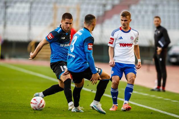 SuperSport HNL, round 15: HNK Hajduk Split v NK Varazdin Aleksa Latkovic of NK Varazdin and Simun Hrgovic of HNK Hajduk Split during the SuperSport HNL 2025. 2026. round 15 match between HNK Hajduk Split and NK Varazdin at Poljud Stadium in Split, Croatia on November 29, 2025.  ZvonimirxBarisin PIXSELL