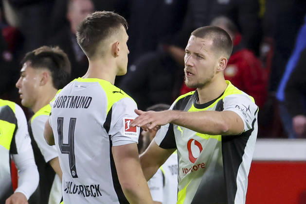 Nico Schlotterbeck Borussia Dortmund and Waldemar Anton Borussia Dortmund cheer, Bundesliga, Bayer 04 Leverkusen v Borussia Dortmund, BayArena, November 29, 2025 in Leverkusen, Germany Photo by Marco Steinbrenner DeFodi Images Nico Schlotterbeck Borussia Dortmund and Waldemar Anton Borussia Dortmund cheer, Bundesliga, Bayer 04 Leverkusen v Borussia Dortmund, BayArena, November 29, 2025 in Leverkusen, Germany Photo by Marco Steinbrenner DeFodi Images DFL regulations prohibit any use of photographs as image sequences and or quasi video