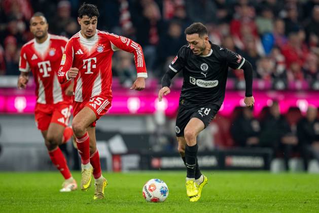 in duel, action, with Alexandar Pavlovic 45 FC Bayern Muenchen , Mathias Pereira situation 28 FC St Pauli , FC Bayern Muenchen vs FC St Pauli, Football, 1 Bundesliga, Matchday 12, 29 11 2025 DFB regulations prohibit any use of photographs as image sequences and or quasi video Muenchen Bayern Germany Copyright: xkolbert-press MarcxMarasescux