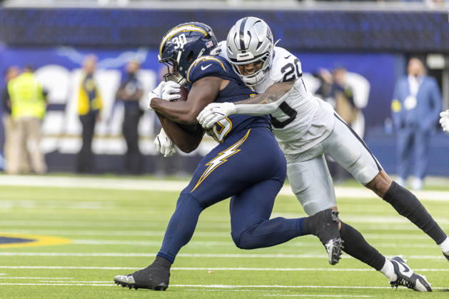 NFL, American Football Herren, USA 2025: Los Angeles Chargers 31:14 Las Vegas Raiders Los Angeles Chargers running back Kimani Vidal 30 is tackled by Las Vegas Raiders safety Isaiah Pola-Mao 20 during an NFL football game at SoFi Stadium, Sunday Nov. 30, 2025, in Inglewood, Calif. Los Angeles United States Copyright: xRingoxChiux xSOPAxImagesx 20251130RC.Chargers021