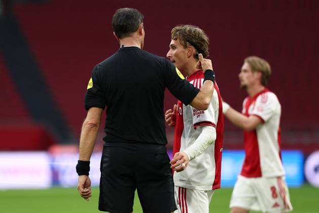 AMSTERDAM , 02-12-2025 , JohanCruyff Arena , season 2025 2026 , Dutch Eredivisie Football , match between Ajax and FC Groningen (replay) , Picture shows , referee Bas Nijhuis, Ajax player Mika Godts Ajax - Groningen (replay) x32313249x Copyright:
