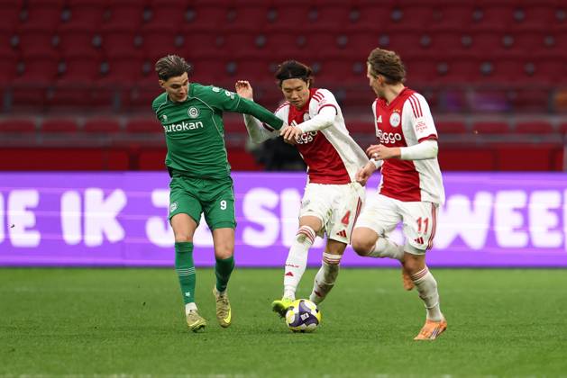 AMSTERDAM , 02-12-2025 , JohanCruyff Arena , season 2025 2026 , Dutch Eredivisie Football , match between Ajax and FC Groningen (replay) , Picture shows , FC Groningen player Brynjolfur Willumsson, Ajax player Ko Itakura, .Ajax player Mika Godts Ajax - Groningen (replay) x32313326x Copyright: