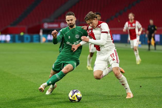 AMSTERDAM , 02-12-2025 , JohanCruyff Arena , season 2025 2026 , Dutch Eredivisie Football , match between Ajax and FC Groningen (replay) , Picture shows , FC Groningen player Marco Rente, Ajax player Mika Godts Ajax - Groningen (replay) x32313331x Copyright: