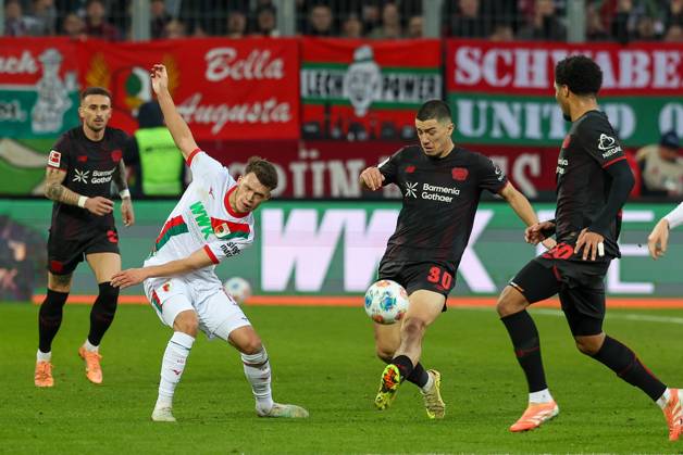 in duel, action, with Robin Fellhauer 19 FC Augsburg , Ibrahim Maza 30 Bayer 04 Leverkusen , FC Augsburg vs Bayer 04 Leverkusen, Soccer, 1 Bundesliga, 13 Matchday, 06 12 2025 DFB regulations prohibit any use of photographs as image sequences and or quasi video Augsburg Bayern Germany Copyright: xkolbert-press ChristianxKolbertx
