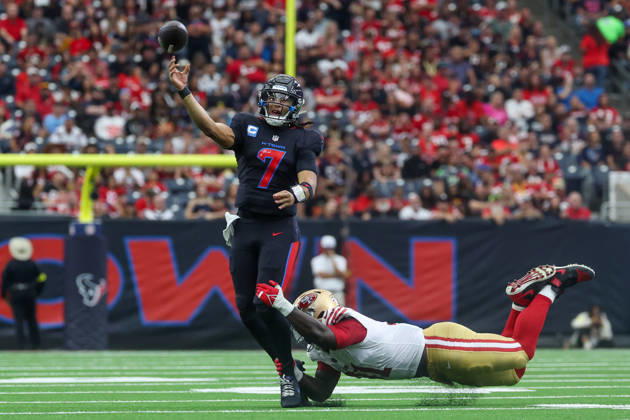 HOUSTON, TX - OCTOBER 26: Quarterback C.J. Stroud 7 of the Houston Texans throws the ball away before defensive tackle Sam Okuayinonu 91 of the San Francisco 49ers can bring him to the ground during the NFL, American Football Herren, USA game between Houston Texans and San Francisco 49ers on October 26, 2025, at NRG Stadium in Houston, TX. (Photo by David Buono Icon Sportswire) NFL: OCT 26 49ers at Texans EDITORIAL USE ONLY Icon251026012