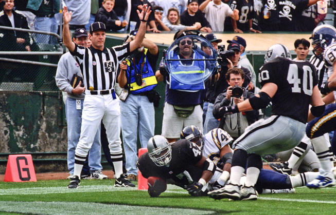 November 14, 1999 - Oakland, California, U.S - Oakland Raiders vs. San Diego Chargers at Oakland Alameda County Coliseum Sunday, November 14, 1999. Raiders beat Chargers 28-9. Oakland Raiders running back Tyrone Wheatley (47) dives for touchdown. Copyright: xAlxGolubx