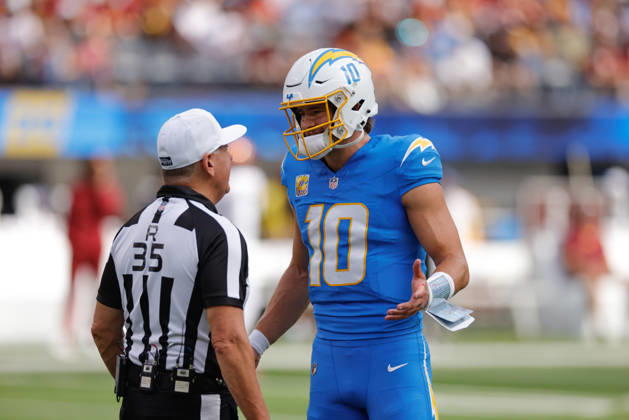 INGLEWOOD, CA - OCTOBER 5: Los Angeles Chargers quarterback Justin Herbert (10) talks with referee John Hussey (35) during the NFL, American Football Herren, USA game between the Washington Commanders and the Los Angeles Chargers on October 05, 2025, at SoFi Stadium in Inglewood, CA. (Photo by Jevone Moore Icon Sportswire) NFL: OCT 05 Commanders at Chargers EDITORIAL USE ONLY Icon20251005005
