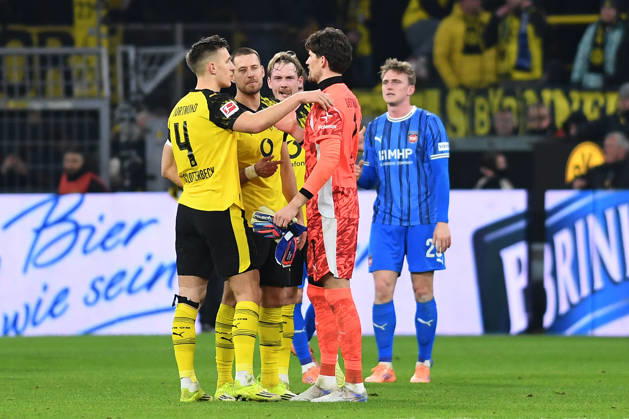 Nico Schlotterbeck Borussia Dortmund , Waldemar Anton Borussia Dortmund , Julian Brandt Borussia Dortmund and goalkeeper Gregor Kobel Borussia Dortmund look on during the Bundesliga match between Borussia Dortmund and 1 FC Heidenheim 1846, Signal Iduna Park on February 01, 2026 in Dortmund, Germany Photo by Ralf Treese DeFodi Images Nico Schlotterbeck Borussia Dortmund , Waldemar Anton Borussia Dortmund , Julian Brandt Borussia Dortmund and goalkeeper Gregor Kobel Borussia Dortmund look on during the Bundesliga match between Borussia Dortmund and 1 FC Heidenheim 1846 at Signal Iduna Park on February 1, 2026 in Dortmund, Germany Photo by Ralf Treese DeFodi Images DFL regulations prohibit any use of photographs as image sequences and or quasi video Photo by Ralf Treese DeFodi Images