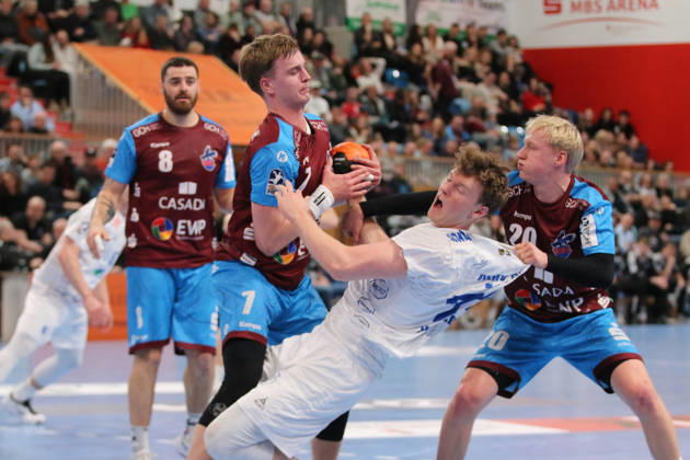 13 02 2026 Handball Men 2025 2026 2 Handball Bundesliga 19 Matchday 1 VfL Potsdam Dessau Roßlauer HV 06 MBS Arena Potsdam Tim Hertzfeld Dessau, 72, white in a duel with Nicolas Paulnsteiner Potsdam, 7, red and Tim Hildenbrand Potsdam, 20, red Potsdam Brandenburg Germany