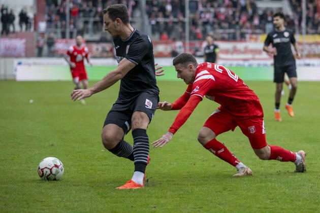 Regionalliga Nordost Season 25 26 Hallescher FC vs Greifswalder FC Halle, Germany February 21, 2026 In the picture from left Bastian Strietzel Greifswald and Marius Hauptmann Halle Halle Saale Leuna Chemie Stadion Sachsen Anhalt Germany