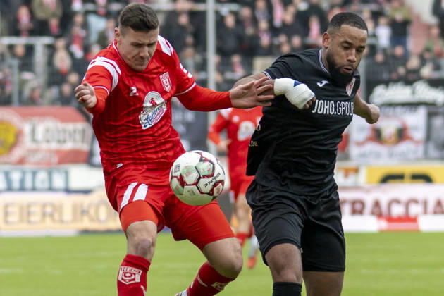 Regionalliga Nordost Season 25 26 Hallescher FC vs Greifswalder FC Halle, Germany February 21, 2026 In the picture from left in the duel Marius Hauptmann Halle and Jason Tomety Hemazro Greifswald Halle Saale Leuna Chemie Stadium Saxony Anhalt Germany