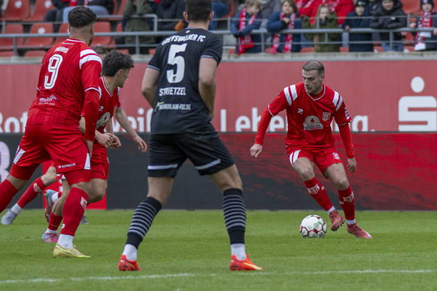 Regionalliga Nordost season 25 26 Hallescher FC vs Greifswalder FC Halle, Germany February 21, 2026 In the picture from left Malek Fakhro Halle , Joscha Wosz Halle , Bastian Strietzel Greifswald and Max Kulke Halle Halle Saale Leuna Chemie Stadion Sachsen Anhalt Germany