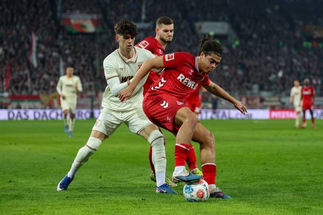 in duel, action, with Rodrigo Ribeiro 21 FC Augsburg , Jahmai Simpson Pusey 22 1 FC Koeln , FC Augsburg vs 1 FC Koeln, Football, 1 Bundesliga, 24 Matchday, 27 02 2026 DFB regulations prohibit any use of photographs as image sequences and or quasi video Augsburg Bayern Germany Copyright: xkolbert-press ChristianxKolbertx