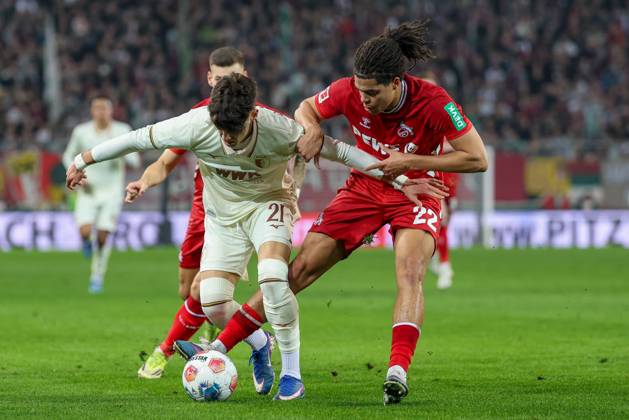 in duel, action, with Rodrigo Ribeiro 21 FC Augsburg , Jahmai Simpson Pusey 22 1 FC Koeln , FC Augsburg vs 1 FC Koeln, Football, 1 Bundesliga, 24 Matchday, 27 02 2026 DFB regulations prohibit any use of photographs as image sequences and or quasi video Augsburg Bayern Germany Copyright: xkolbert-press ChristianxKolbertx