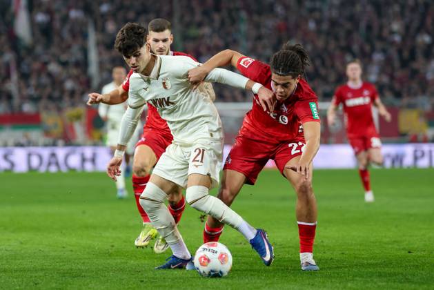 in duel, action, with Rodrigo Ribeiro 21 FC Augsburg , Jahmai Simpson Pusey 22 1 FC Koeln , FC Augsburg vs 1 FC Koeln, Football, 1 Bundesliga, 24 Matchday, 27 02 2026 DFB regulations prohibit any use of photographs as image sequences and or quasi video Augsburg Bayern Germany Copyright: xkolbert-press ChristianxKolbertx