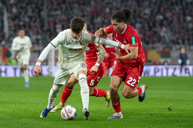 in duel, action, with Rodrigo Ribeiro 21 FC Augsburg , Jahmai Simpson Pusey 22 1 FC Koeln , FC Augsburg vs 1 FC Koeln, Football, 1 Bundesliga, 24 Matchday, 27 02 2026 DFB regulations prohibit any use of photographs as image sequences and or quasi video Augsburg Bayern Germany Copyright: xkolbert-press ChristianxKolbertx