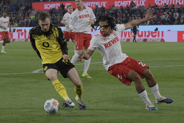 from left in duel Maximilian Beier Dortmund 14 Jahmai Simpson Pusey Koeln 22 07 03 2026¢ Football ¢ 1 FC Koeln vs Borussia Dortmund , Rheinenergiestadion, Koeln, DFB DFL REGULATIONS PROHIBIT ANY USE OF PHOTOGRAPHS AS IMAGE SEQUENCES AND OR QUASI VIDEO Copyright: xpepphotox xHorstxMauelshagenx pep00321, pep_20260307_hm_300911