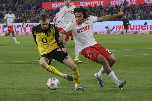 from left in duel Maximilian Beier Dortmund 14 Jahmai Simpson Pusey Koeln 22 07 03 2026¢ Football ¢ 1 FC Koeln vs Borussia Dortmund , Rheinenergiestadion, Koeln, DFB DFL REGULATIONS PROHIBIT ANY USE OF PHOTOGRAPHS AS IMAGE SEQUENCES AND OR QUASI VIDEO Copyright: xpepphotox xHorstxMauelshagenx pep00321, pep_20260307_hm_300910
