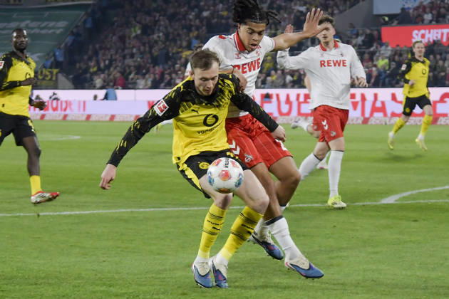 from left in duel Maximilian Beier Dortmund 14 Jahmai Simpson Pusey Koeln 22 07 03 2026¢ Football ¢ 1 FC Koeln vs Borussia Dortmund , Rheinenergiestadion, Koeln, DFB DFL REGULATIONS PROHIBIT ANY USE OF PHOTOGRAPHS AS IMAGE SEQUENCES AND OR QUASI VIDEO Copyright: xpepphotox xHorstxMauelshagenx pep00321, pep_20260307_hm_300907