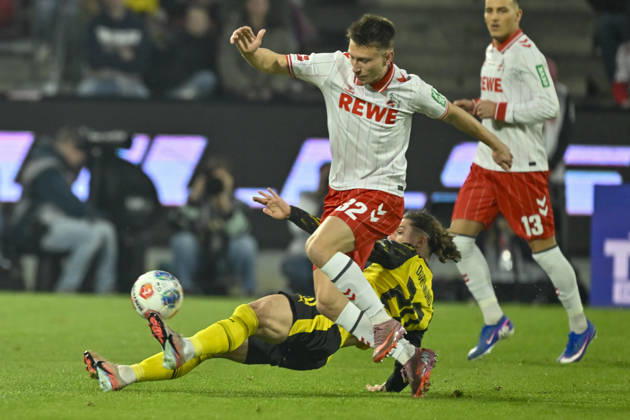 from left in duel Maximilian Beier Dortmund 14 Kristoffer Lund Koeln 32 07 03 2026¢ Football ¢ 1 FC Koeln vs Borussia Dortmund , Rheinenergiestadion, Koeln, DFB DFL REGULATIONS PROHIBIT ANY USE OF PHOTOGRAPHS AS IMAGE SEQUENCES AND OR QUASI VIDEO Copyright: xpepphotox xHorstxMauelshagenx pep00321, pep_20260307_hm_301090