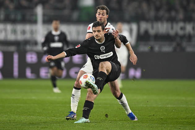 v li in duel Joe Scally Moenchengladbach 29 Adam Dzwigala Pauli 25 13 03 2026 ¢ Football ¢ Borussia Moenchengladbach vs FC St Pauli, Borussia Park, Moenchengladbach, DFB DFL REGULATIONS PROHIBIT ANY USE OF PHOTOGRAPHS AS IMAGE SEQUENCES AND OR QUASI VIDEO Copyright: xpepphotox xHorstxMauelshagenx pep00321, pep_20260313_hm_306414