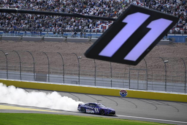 LAS VEGAS, NV - MARCH 15: Denny Hamlin ( 11 Joe Gibbs Racing Yahoo! Toyota) celebrates with a burnout down the front straight after winning the NASCAR, Motorsport, USA Cup Series Pennzoil 400 on March 15, 2026, at Las Vegas Motor Speedway in Las Vegas, NV. (Photo by Will Lester Icon Sportswire) AUTO: MAR 15 NASCAR Cup Series Pennzoil 400 EDITORIAL USE ONLY Icon24031515434