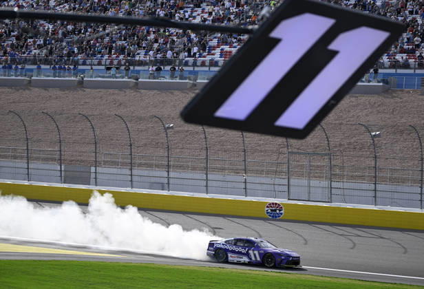 LAS VEGAS, NV - MARCH 15: Denny Hamlin ( 11 Joe Gibbs Racing Yahoo! Toyota) celebrates with a burnout down the front straight after winning the NASCAR, Motorsport, USA Cup Series Pennzoil 400 on March 15, 2026, at Las Vegas Motor Speedway in Las Vegas, NV. (Photo by Will Lester Icon Sportswire) AUTO: MAR 15 NASCAR Cup Series Pennzoil 400 EDITORIAL USE ONLY Icon24031515441