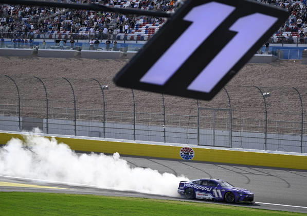 LAS VEGAS, NV - MARCH 15: Denny Hamlin ( 11 Joe Gibbs Racing Yahoo! Toyota) celebrates with a burnout down the front straight after winning the NASCAR, Motorsport, USA Cup Series Pennzoil 400 on March 15, 2026, at Las Vegas Motor Speedway in Las Vegas, NV. (Photo by Will Lester Icon Sportswire) AUTO: MAR 15 NASCAR Cup Series Pennzoil 400 EDITORIAL USE ONLY Icon24031515450