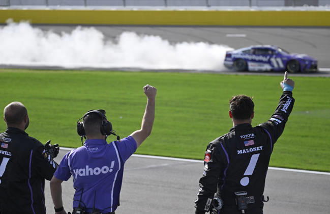 LAS VEGAS, NV - MARCH 15: Denny Hamlin ( 11 Joe Gibbs Racing Yahoo! Toyota) celebrates with a burnout down the front straight as his crew reacts after winning the NASCAR, Motorsport, USA Cup Series Pennzoil 400 on March 15, 2026, at Las Vegas Motor Speedway in Las Vegas, NV. (Photo by Will Lester Icon Sportswire) AUTO: MAR 15 NASCAR Cup Series Pennzoil 400 EDITORIAL USE ONLY Icon24031515477