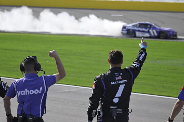 LAS VEGAS, NV - MARCH 15: Denny Hamlin ( 11 Joe Gibbs Racing Yahoo! Toyota) celebrates with a burnout down the front straight as his crew reacts after winning the NASCAR, Motorsport, USA Cup Series Pennzoil 400 on March 15, 2026, at Las Vegas Motor Speedway in Las Vegas, NV. (Photo by Will Lester Icon Sportswire) AUTO: MAR 15 NASCAR Cup Series Pennzoil 400 EDITORIAL USE ONLY Icon24031515480