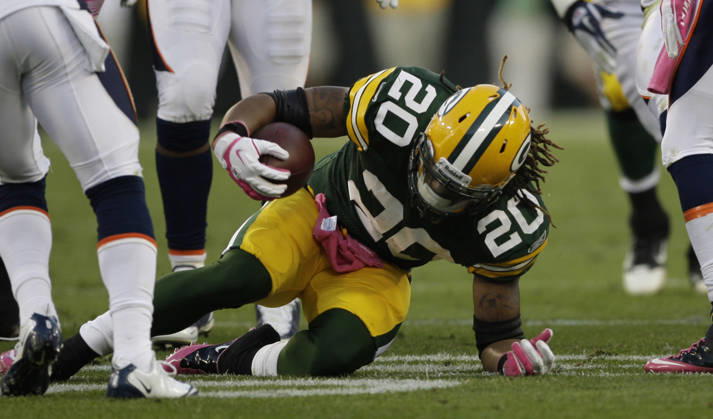 Oct. 2, 2011 - Green Bay, WI, USA - Green Bay Packers running back Alex Green is brought down after an eight-yard run late in the fourth quarter against the Denver Broncos at Lambeau Field in Green Bay, Wisconsin, Sunday, October 2, 2011. The Packers defeated the Broncos, 49-23. Copyright: xJohnxKleinx