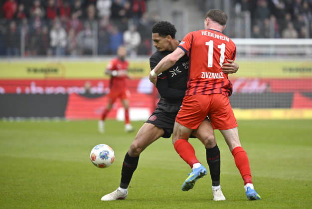 One-on-one, action Budu Zivzivadze Siwsiwadse 1 FC Heidenheim 1846 FCH 11 vs Jarell Quansah Bayer 04 Leverkusen 04 1 FC Heidenheim 1846 FCH vs Bayer 04 Leverkusen B04 21 03 2026 DFL REGULATIONS PROHIBIT ANY USE OF PHOTOGRAPHS AS IMAGE SEQUENCES AND OR QUASI VIDEO 1 FC Heidenheim 1846 FCH vs Bayer 04 Leverkusen