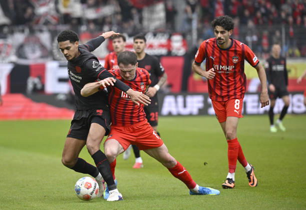 One-on-one, action Budu Zivzivadze Siwsiwadse 1 FC Heidenheim 1846 FCH 11 vs Jarell Quansah Bayer 04 Leverkusen 04 Eren Dinkci 1 FC Heidenheim 1846 FCH 08 1 FC Heidenheim 1846 FCH vs Bayer 04 Leverkusen B04 21 03 2026 DFL REGULATIONS PROHIBIT ANY USE OF PHOTOGRAPHS AS IMAGE SEQUENCES AND OR QUASI VIDEO 1 FC Heidenheim 1846 FCH vs Bayer 04 Leverkusen