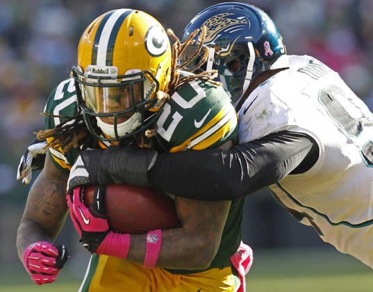 Oct. 28, 2012 - Green Bay, WI, USA - Green Bay Packers running back Alex Green is stopped by Jacksonville Jaguars Jeremy Mincey durng the waning moments of the fourth quarter at Lambeau Field in Green Bay, Wisconsin, Sunday, October 28, 2012. The Packers beat the Jaguars, 25-15. Copyright: xMarkxHoffmanx