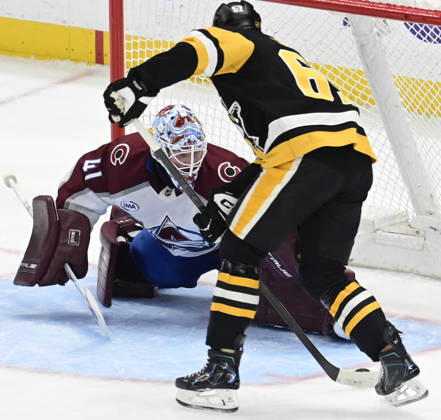 Pittsburgh Penguins right wing Rickard Rakell (67) scores on Colorado Avalanche goaltender Scott Wedgewood (41) in the third period of the Pittsburgh Penguins 6-2 lost at PPG Paints Arena in Pittsburgh on Tuesday, March 24, 2026.  PIT2026032420 ARCHIExCARPENTER