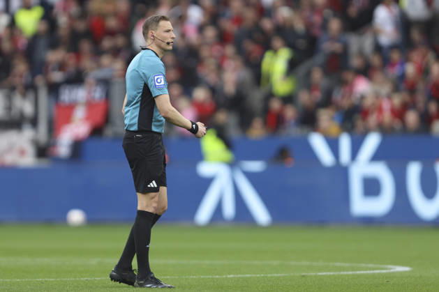 Referee Martin Petersen looks on during the Bundesliga match between Bayer 04 Leverkusen and VfL Wolfsburg, BayArena on April 04, 2026 in Leverkusen, Germany Photo by Oliver Kaelke DeFodi Images Referee Martin Petersen looks on during the Bundesliga match between Bayer 04 Leverkusen and VfL Wolfsburg at BayArena on April 4, 2026 in Leverkusen, Germany Photo by Oliver Kaelke DeFodi Images DFL regulations prohibit any use of photographs as image sequences and or quasi video Photo by Oliver Kaelke DeFodi Images