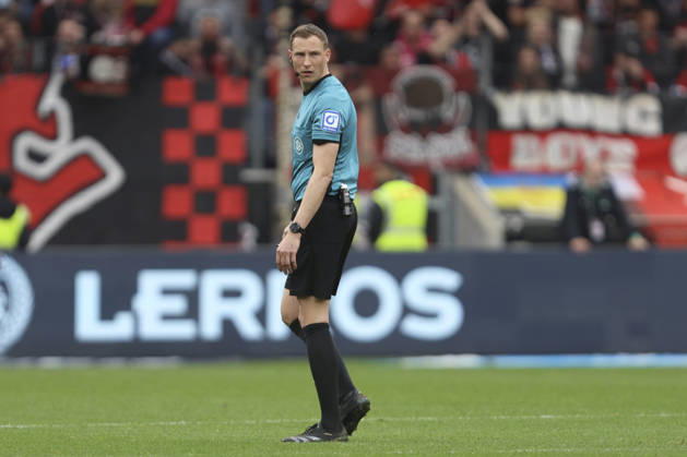 Referee Martin Petersen looks on during the Bundesliga match between Bayer 04 Leverkusen and VfL Wolfsburg, BayArena on April 04, 2026 in Leverkusen, Germany Photo by Oliver Kaelke DeFodi Images Referee Martin Petersen looks on during the Bundesliga match between Bayer 04 Leverkusen and VfL Wolfsburg at BayArena on April 4, 2026 in Leverkusen, Germany Photo by Oliver Kaelke DeFodi Images DFL regulations prohibit any use of photographs as image sequences and or quasi video Photo by Oliver Kaelke DeFodi Images