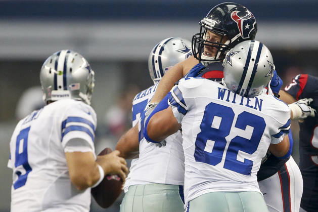 October 05, 2014: Houston Texans defensive end J.J. Watt (99) is blocked by Dallas Cowboys tight end Jason Witten (82) while rushing the the quarterback during the NFL, American Football Herren, USA game between the Houston Texans and the Dallas Cowboys at AT&T Stadium in Arlington, TX. The Cowboys defeated the Texans 20-17 in overtime. Copyright: xTimxWarnerx