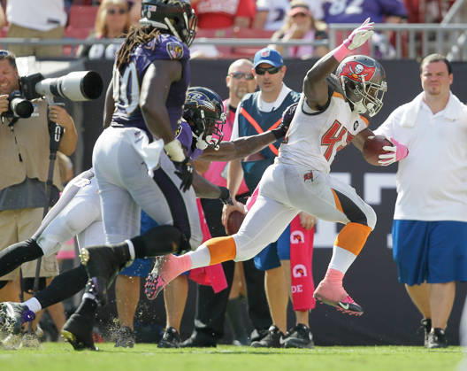 Oct. 12, 2014 - Tampa, FL, USA - Tampa Bay Buccaneers running back Bobby Rainey (43) breaks away for 21 yards during the fourth quarter, setting up a Bucs touchdown against the Baltimore Ravens, on Sunday, Oct. 12, 2014, at Raymond James Stadium in Tampa, Fla. Copyright: xBrendanxFittererx