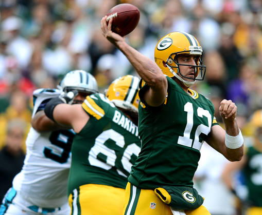 Oct. 19, 2014 - Green Bay, WI, USA - Green Bay Packers quarterback Aaron Rodgers (12) passes to a receiver during the first quarter on Sunday, Oct. 19, 2014, at Lambeau Field in Green Bay, Wis. Copyright: xJeffxSinerx