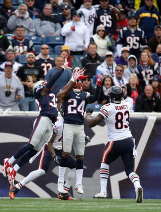 Oct. 26, 2014 - Foxborough, MA, USA - New England Patriots cornerback Darrelle Revis (24) grabs an interception in front of Chicago Bears wide receiver Brandon Marshall (15) before halftime Sunday, Oct. 26, 2014 at Gillette Stadium in Foxborough, Mass. The Patriots defeated the Bears 51-23. Copyright: xBrianxCassellax