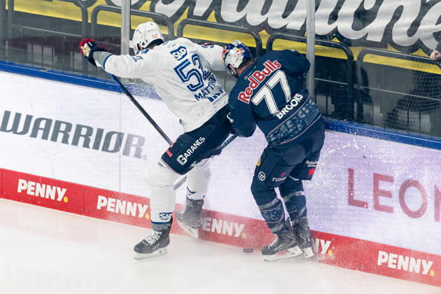 Fight for the puck duel between Nicolas Mattinen Adler Mannheim, 52 and Adam Brooks EHC Red Bull Muenchen, 77 GER, EHC Red Bull Muenchen vs Adler Mannheim, ice hockey, DEL, playoffs, semi-final game 4, season 2025 2026, 14 04 2026 GER, EHC Red Bull Muenchen vs Adler Mannheim, ice hockey, DEL, playoffs, semi-final game 4, season 2025 2026, 14 04 2026 Muenchen Copyright: xEibner-Pressefoto FranzxFeinerx EP_HFR