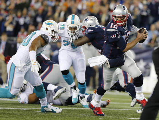 Oct. 29, 2015 - Foxborough, MA, USA - New England Patriots quarterback Tom Brady (12) scrambles in the backfield against the Miami Dolphins at Gillette Stadium in Foxborough, Mass., on Thursday, Oct. 29, 2015. Copyright: xAlxDiazx