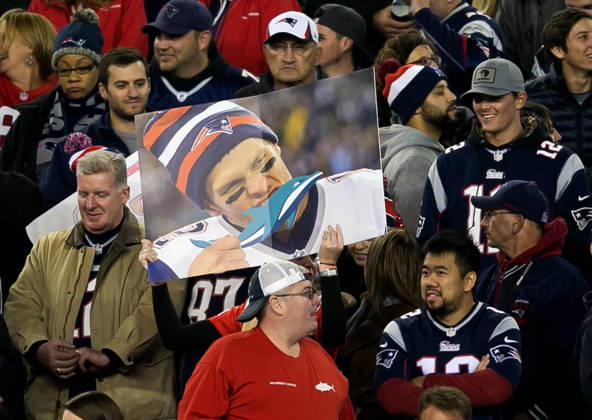 Oct. 29, 2015 - Foxborough, Ma., U.S. - A New England Patriot fan holds up a poster of Tom Brady chewing on a dolphin at Gillette Stadium in Foxborough, Massachusetts during their game against the Miami Dolphins. Patriots won 36-7. Copyright: xAllenxEyestonex