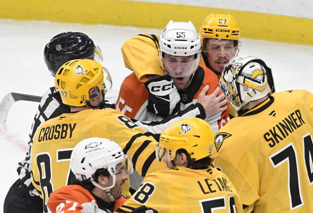 Pittsburgh Penguins right wing Rickard Rakell (67) holds back Philadelphia Flyers defenseman Rasmus Ristolainen (55) after fighting with Pittsburgh Penguins center Sidney Crosby (87) in the first period during game two in the opening round of the Eastern Conference playoffs between the Pittsburgh Penguins and Philadelphia Flyers at PPG Paints Arena in Pittsburgh on Monday, April 20, 2026.  PIT2026042004 ARCHIExCARPENTER
