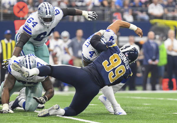 October 01, 2017: Dallas Cowboys quarterback Dak Prescott 4 escapes what would be a sack in the second quarter by Los Angeles Rams defensive tackle Caushaud Lyons 99 during an NFL, American Football Herren, USA football game between the Los Angeles Rams and the Dallas Cowboys at AT&T Stadium in Arlington, TX Dallas leads at the half 24-16 Albert Pena CSM Copyright: xAlbertxPenax